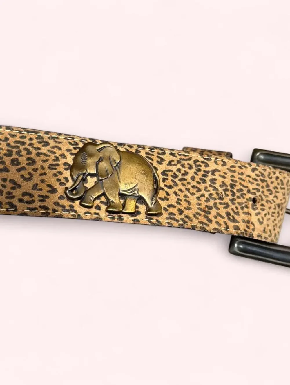 Leopard print western belt with animal accents throughout and chunky buckle!